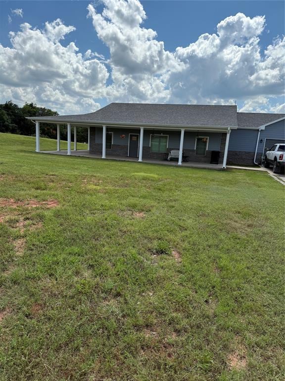 105967 S Rolling Hills Dr, Meeker, OK 74855 - view of front of home with a front lawn