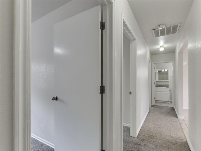 216 S 5th St, Noble, OK 73068 - corridor featuring light colored carpet and light tile patterned floors