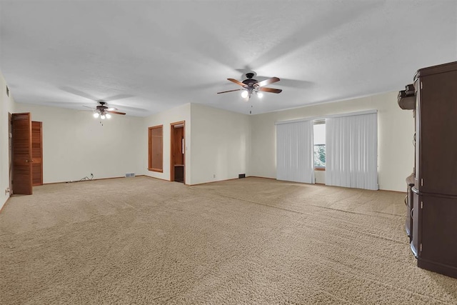 315 W 6th St, Cordell, OK 73632 - unfurnished living room with a ceiling fan and light colored carpet