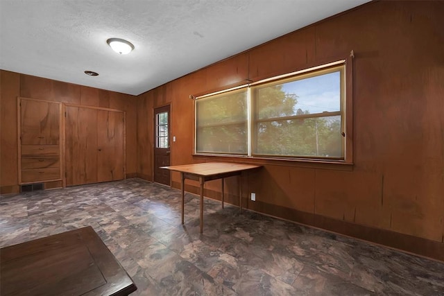 315 W 6th St, Cordell, OK 73632 - foyer featuring a textured ceiling and wooden walls