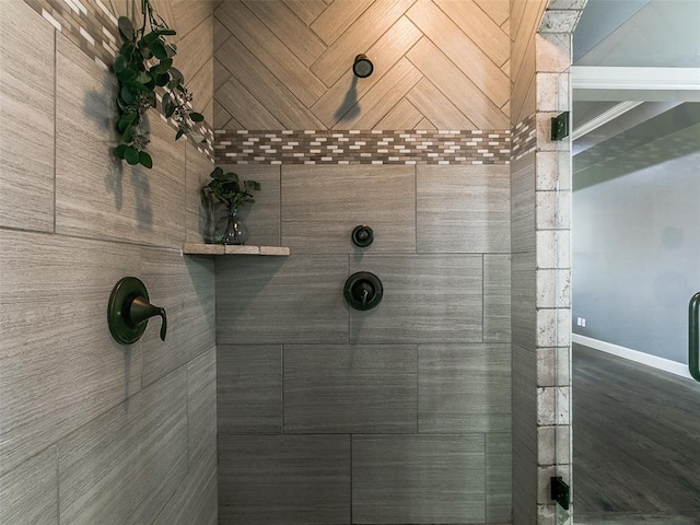 3009 Cordova Ct, Norman, OK 73072 - bathroom featuring a tile shower and baseboards