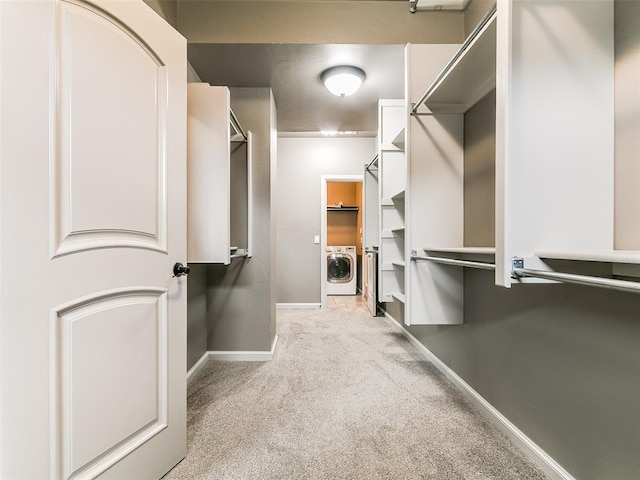 3009 Cordova Ct, Norman, OK 73072 - walk in closet featuring washer / dryer and carpet