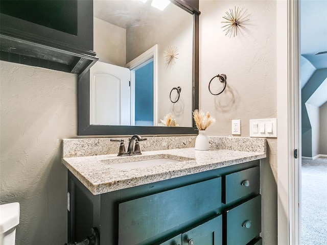 3009 Cordova Ct, Norman, OK 73072 - bathroom featuring vanity and a textured wall