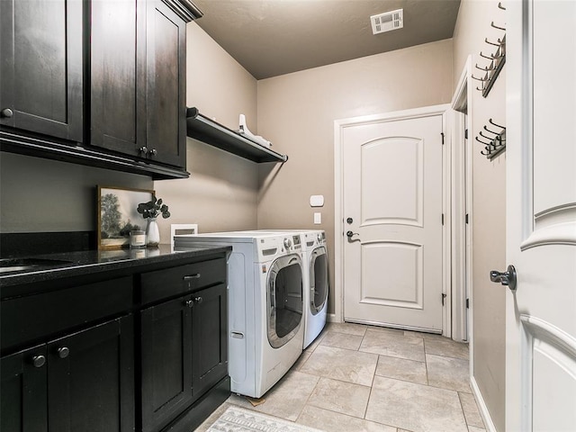3009 Cordova Ct, Norman, OK 73072 - washroom with cabinet space and separate washer and dryer