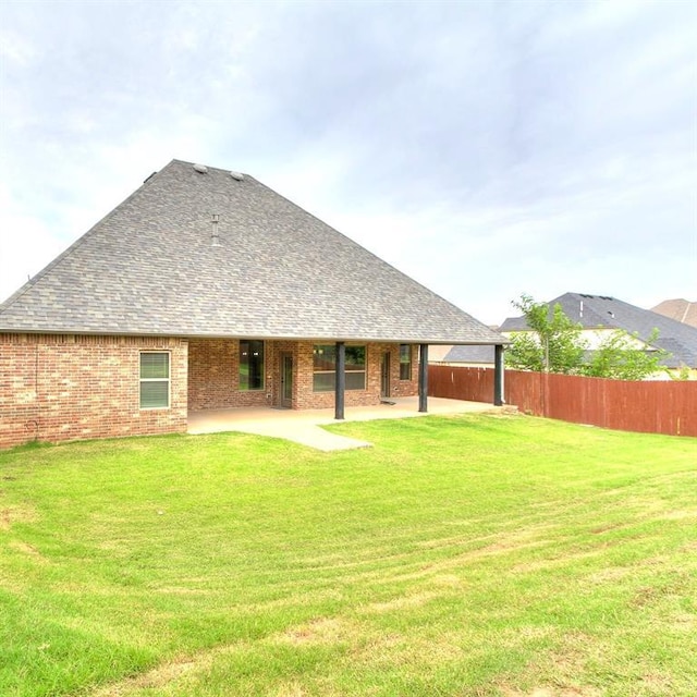 3009 Cordova Ct, Norman, OK 73072 - rear view of house featuring a patio, brick siding, and a shingled roof