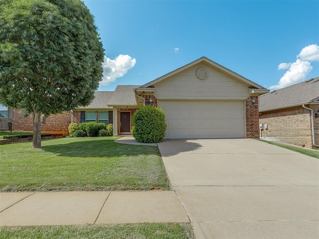 9505 SW 27th St, Oklahoma City, OK 73128 - view of front of home with brick siding, an attached garage, concrete driveway, and a front lawn