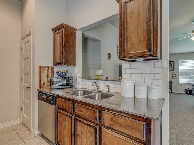 9505 SW 27th St, Oklahoma City, OK 73128 - kitchen featuring stainless steel dishwasher, black microwave, dark stone counters, and decorative backsplash