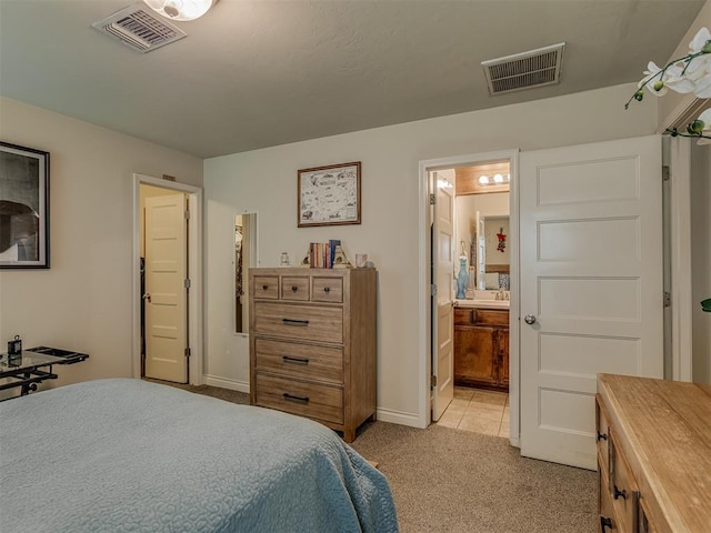 9505 SW 27th St, Oklahoma City, OK 73128 - bedroom with light colored carpet and ensuite bath