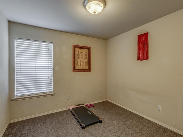 9505 SW 27th St, Oklahoma City, OK 73128 - workout room featuring carpet floors and baseboards