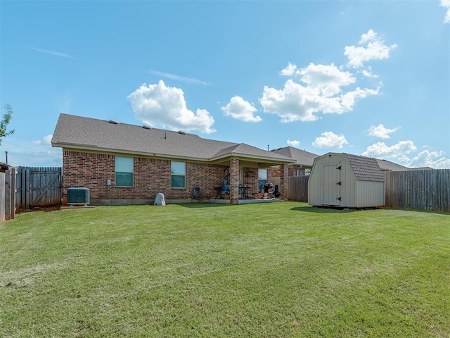 9505 SW 27th St, Oklahoma City, OK 73128 - rear view of property with a storage shed, a fenced backyard, brick siding, and a patio area