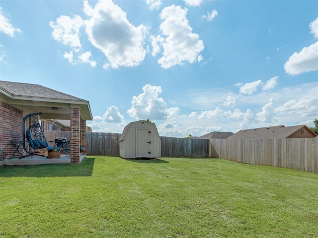 9505 SW 27th St, Oklahoma City, OK 73128 - fenced backyard with a storage shed and a patio area