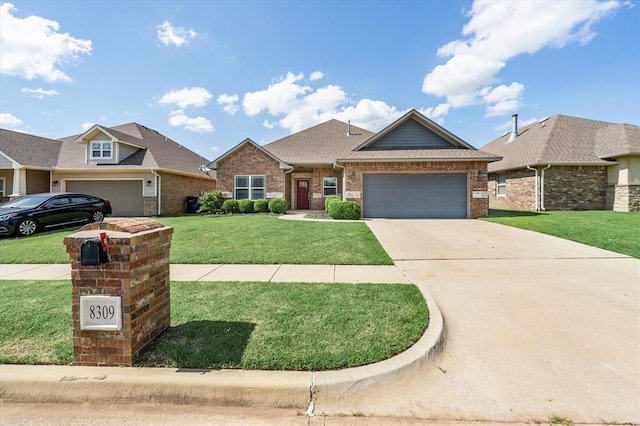 8309 NW 139th Ter, Oklahoma City, OK 73142 - view of front of home featuring a garage, brick siding, driveway, and a front lawn
