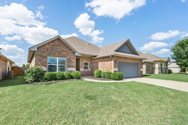 8309 NW 139th Ter, Oklahoma City, OK 73142 - view of front facade with brick siding, an attached garage, concrete driveway, and roof with shingles