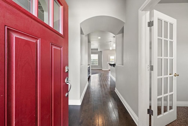 8309 NW 139th Ter, Oklahoma City, OK 73142 - foyer with arched walkways and dark wood finished floors