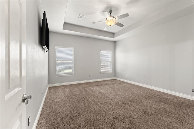 8309 NW 139th Ter, Oklahoma City, OK 73142 - carpeted empty room featuring ceiling fan and a raised ceiling