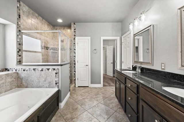 8309 NW 139th Ter, Oklahoma City, OK 73142 - bathroom with a stall shower, a tub with jets, double vanity, and tile patterned floors
