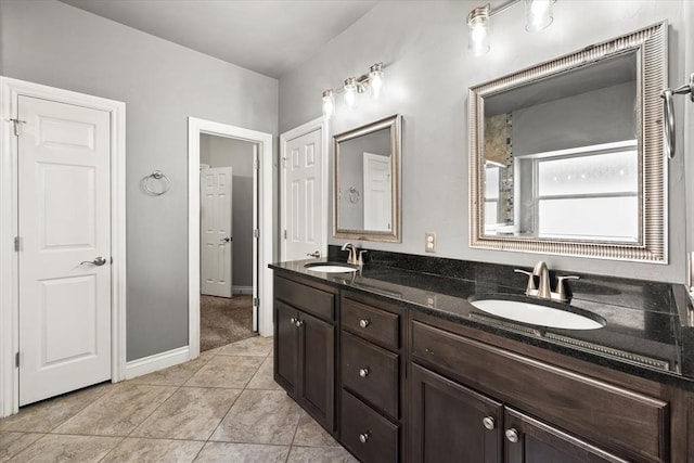 8309 NW 139th Ter, Oklahoma City, OK 73142 - bathroom featuring double vanity and tile patterned floors