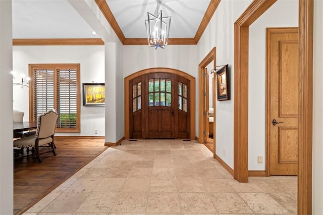 18816 Otter Creek Dr, Edmond, OK 73012 - entryway with a chandelier, crown molding, stone tile flooring, and plenty of natural light