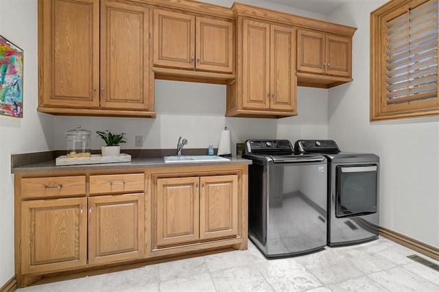 18816 Otter Creek Dr, Edmond, OK 73012 - washroom featuring cabinet space and washing machine and clothes dryer