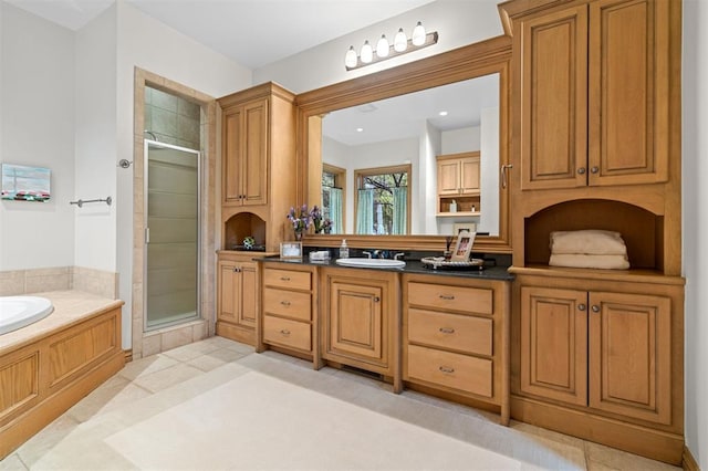 18816 Otter Creek Dr, Edmond, OK 73012 - bathroom with a shower stall, double vanity, a garden tub, and recessed lighting