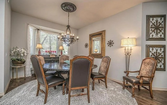 716 Fox Bend Trl, Edmond, OK 73034 - dining space featuring a chandelier and wood finished floors