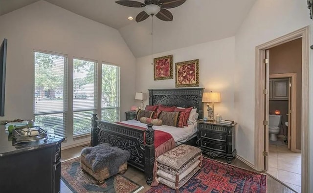 716 Fox Bend Trl, Edmond, OK 73034 - bedroom featuring vaulted ceiling, multiple windows, connected bathroom, and ceiling fan