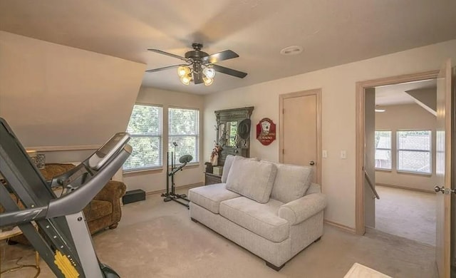 716 Fox Bend Trl, Edmond, OK 73034 - living room featuring light carpet, a ceiling fan, and plenty of natural light