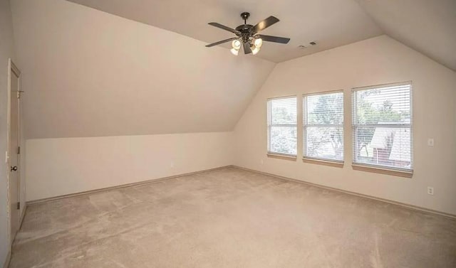 716 Fox Bend Trl, Edmond, OK 73034 - additional living space with lofted ceiling, light carpet, and a ceiling fan