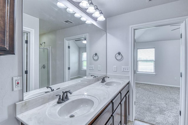 816 Lakeview Dr, Moore, OK 73160 - full bathroom featuring double vanity, a shower with shower door, and ceiling fan