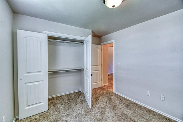 816 Lakeview Dr, Moore, OK 73160 - unfurnished bedroom featuring carpet floors and a closet