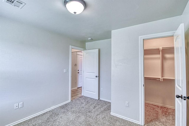 816 Lakeview Dr, Moore, OK 73160 - unfurnished bedroom featuring a spacious closet, carpet, and a closet