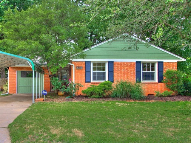 1213 Leslie Ln, Norman, OK 73069 - view of front of house with a front lawn, concrete driveway, and brick siding