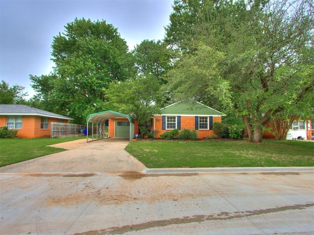 1213 Leslie Ln, Norman, OK 73069 - single story home featuring brick siding, driveway, a detached carport, and a garage