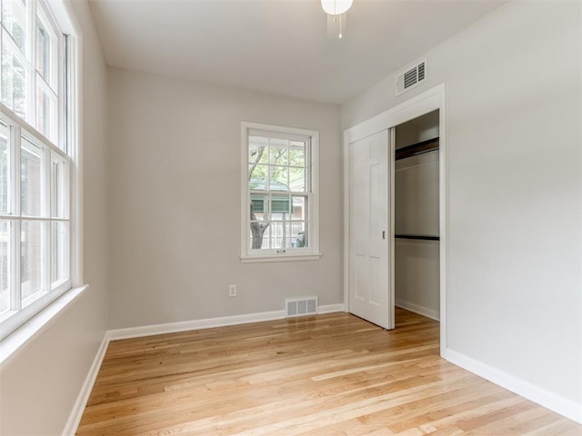 1213 Leslie Ln, Norman, OK 73069 - unfurnished bedroom featuring light wood-style floors and a closet