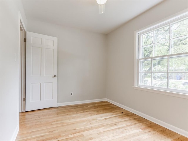1213 Leslie Ln, Norman, OK 73069 - empty room featuring light wood finished floors and baseboards