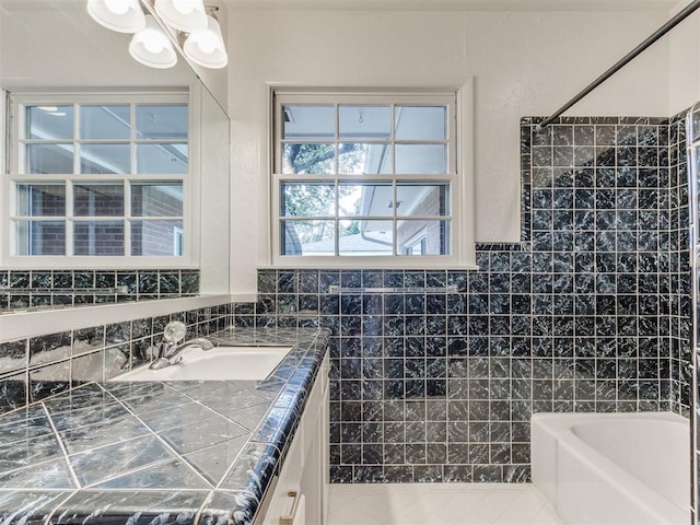 1213 Leslie Ln, Norman, OK 73069 - bathroom with vanity, a chandelier, shower / bathtub combination, tile walls, and tile patterned flooring