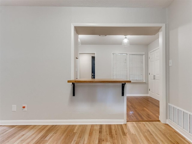 1213 Leslie Ln, Norman, OK 73069 - spare room with light wood-style flooring and baseboards