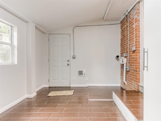1213 Leslie Ln, Norman, OK 73069 - entrance foyer featuring vaulted ceiling and wood finished floors