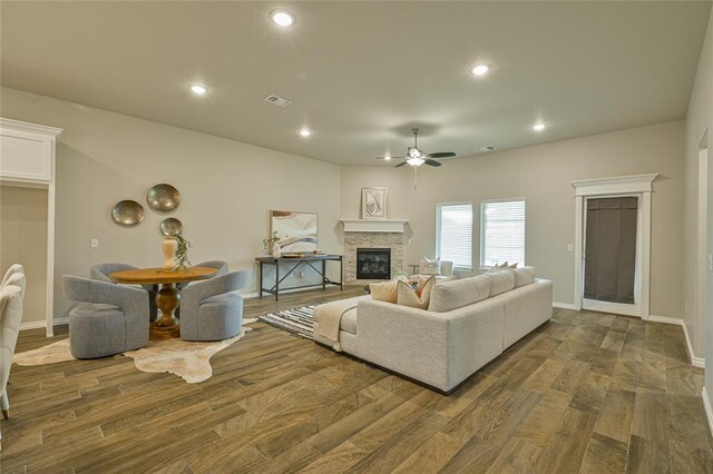 3808 Palmetto Trl, Oklahoma City, OK 73179 - living area with a ceiling fan, a stone fireplace, wood finished floors, and recessed lighting