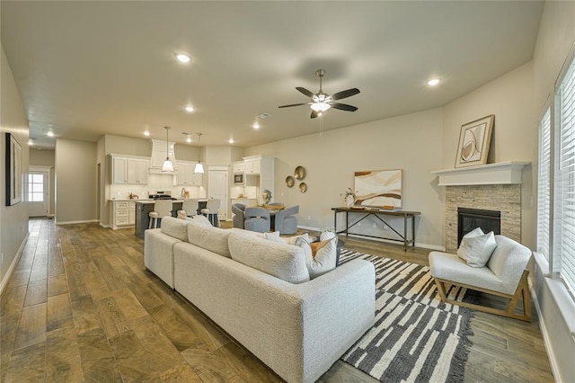 3808 Palmetto Trl, Oklahoma City, OK 73179 - living room with a ceiling fan, dark wood-style flooring, recessed lighting, and a fireplace