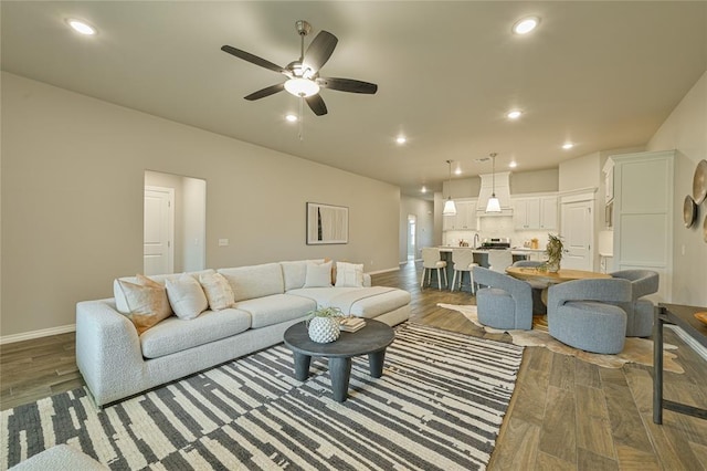 3808 Palmetto Trl, Oklahoma City, OK 73179 - living room featuring wood finished floors, a ceiling fan, and recessed lighting
