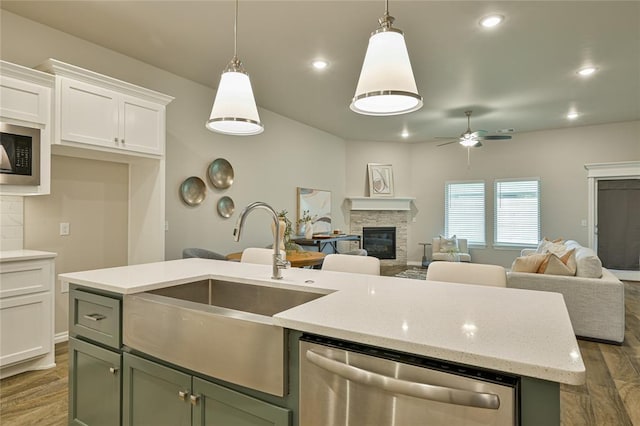 3808 Palmetto Trl, Oklahoma City, OK 73179 - kitchen with appliances with stainless steel finishes, open floor plan, wood finished floors, and recessed lighting