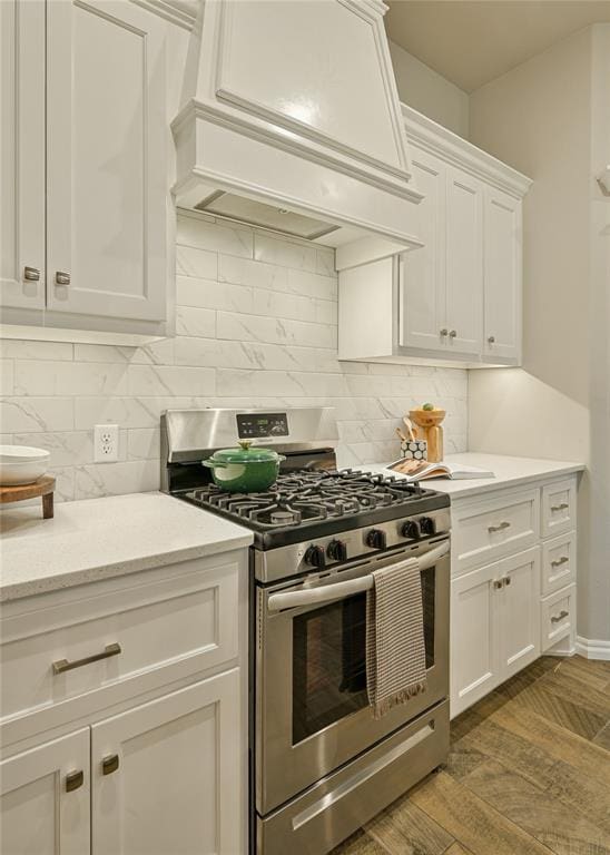 3808 Palmetto Trl, Oklahoma City, OK 73179 - kitchen featuring gas stove, premium range hood, white cabinetry, and tasteful backsplash