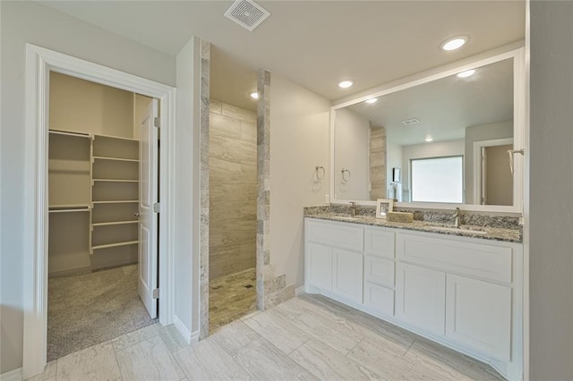 3808 Palmetto Trl, Oklahoma City, OK 73179 - full bath featuring walk in shower, double vanity, a walk in closet, and recessed lighting