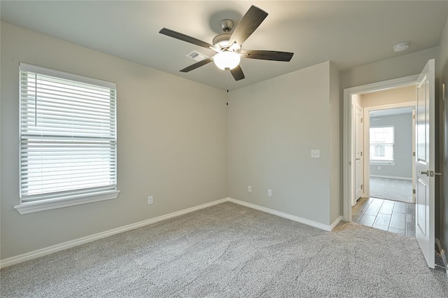 3808 Palmetto Trl, Oklahoma City, OK 73179 - spare room with ceiling fan, light colored carpet, and a smoke detector