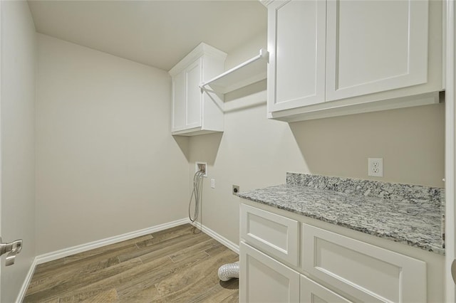 3808 Palmetto Trl, Oklahoma City, OK 73179 - washroom featuring light wood finished floors, electric dryer hookup, cabinet space, and washer hookup