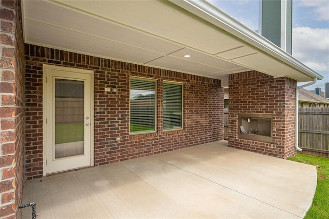 3808 Palmetto Trl, Oklahoma City, OK 73179 - view of patio / terrace featuring an outdoor brick fireplace