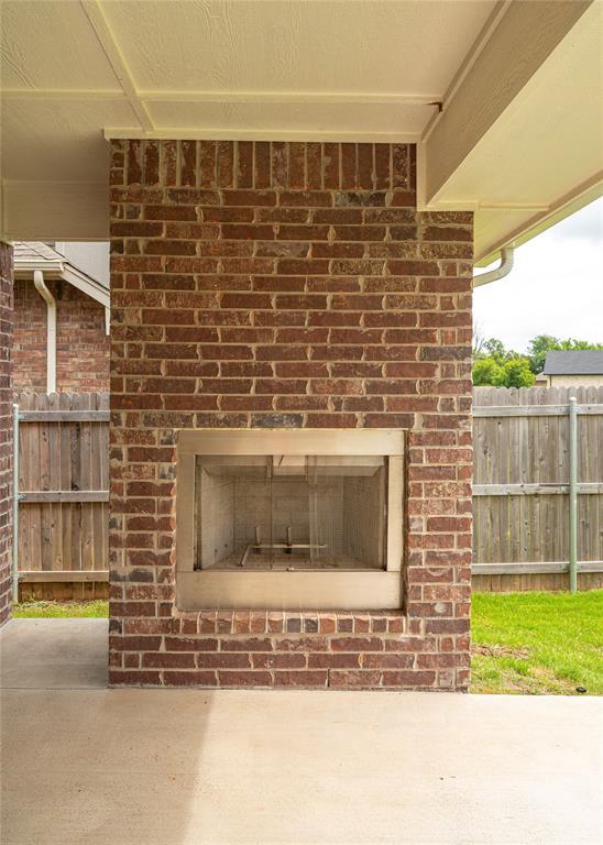 3808 Palmetto Trl, Oklahoma City, OK 73179 - exterior view of an outdoor brick fireplace