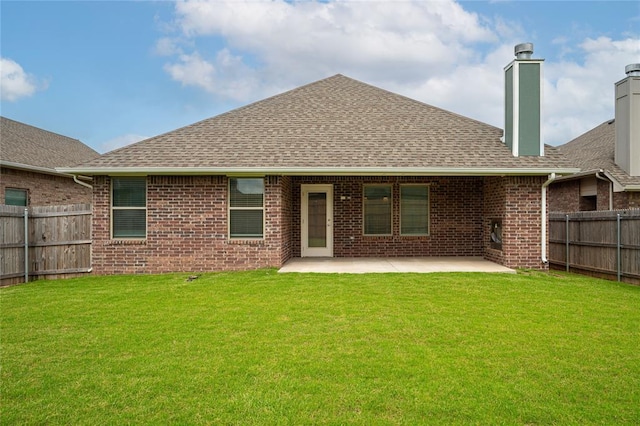 3808 Palmetto Trl, Oklahoma City, OK 73179 - rear view of house featuring brick siding, a shingled roof, a patio area, and a chimney
