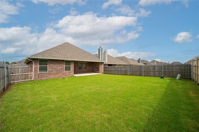 3808 Palmetto Trl, Oklahoma City, OK 73179 - back of property featuring a fenced backyard, a patio, brick siding, a shingled roof, and a chimney